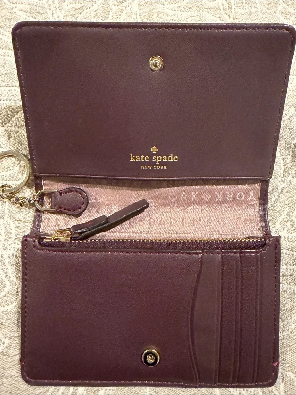 kate spade Plum Pebbled Leather Card Case with Gold Logo